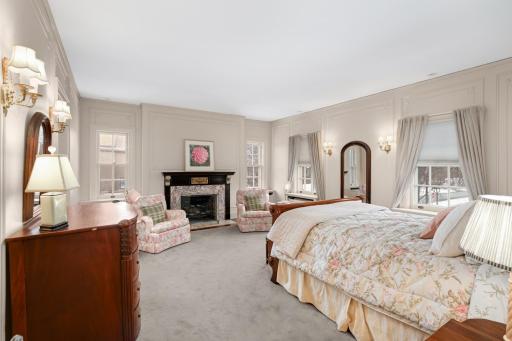 2nd floor bedroom with decorative fireplace.
