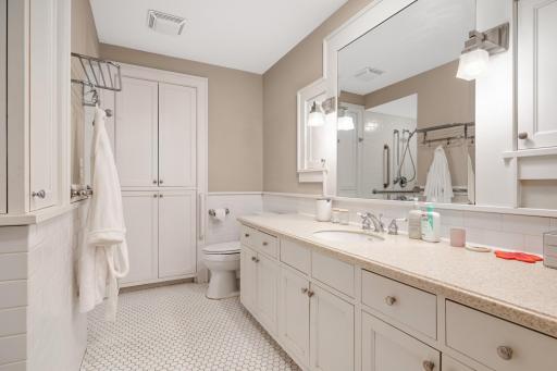 1 of two bathrooms in the basement with roll in shower.