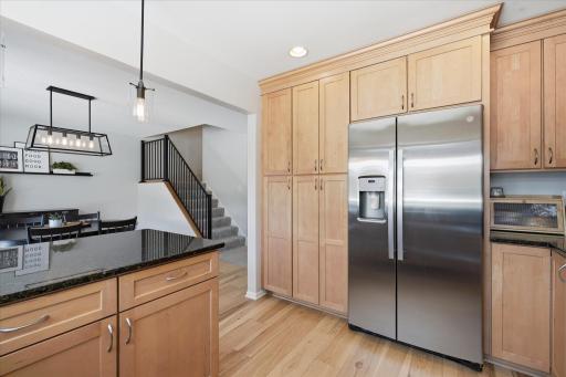 There is an abundance of storage and pantry space in the kitchen.