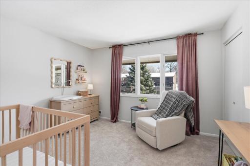 Bedroom #2 on the upper level. There are hardwood floors underneath the carpet in this bedroom.