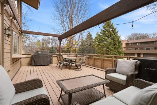 Huge maintenance free deck with newer deck railings.