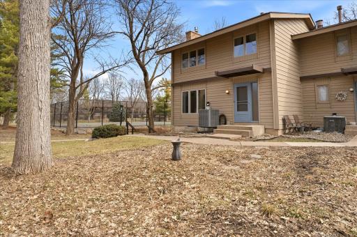The front of the home looks out to a nice private common area and is adjacent to the tennis courts.