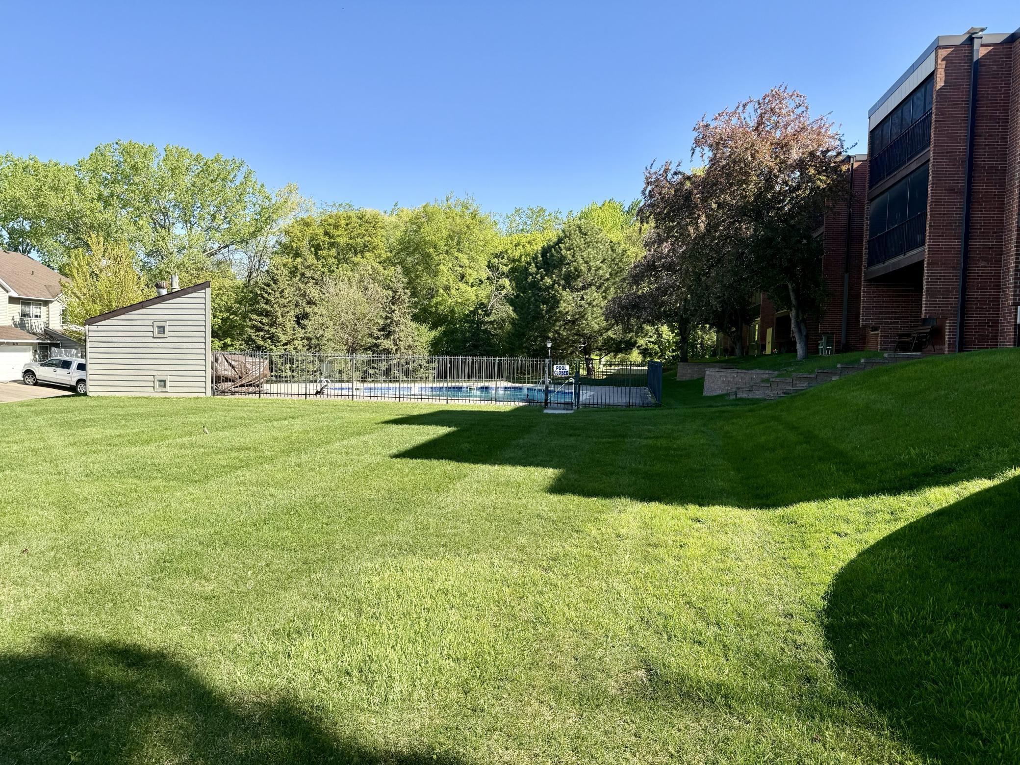 There's a large green space and in ground pool!