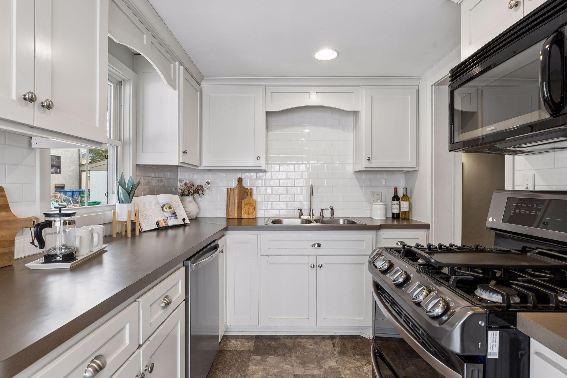 Lovely subway-tiled backsplash and stainless steel appliances