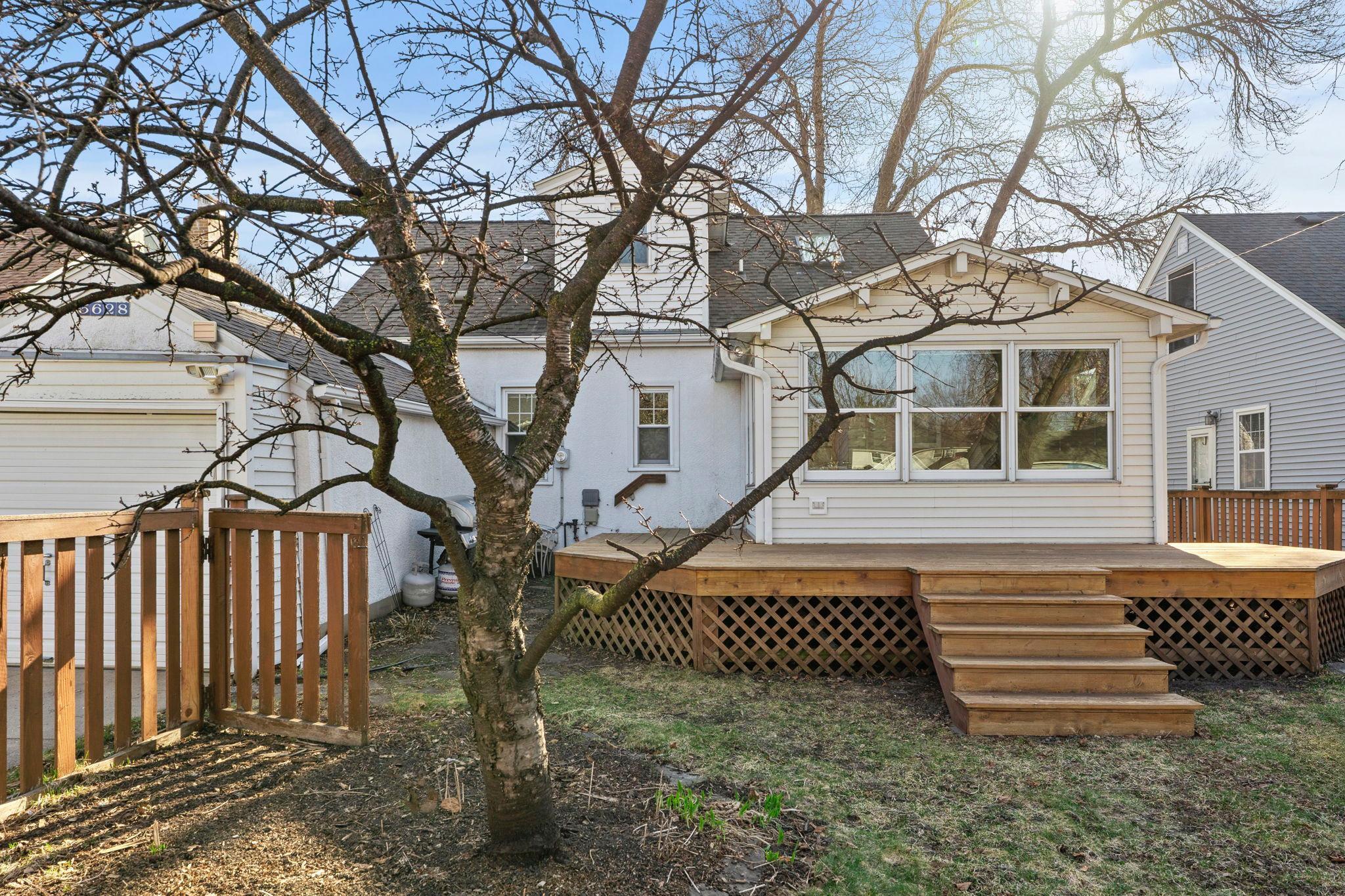 Large wrap-around deck in backyard