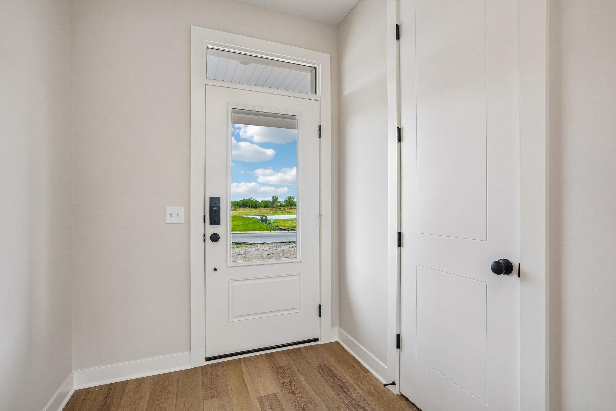 Inviting foyer complete with coat closet.