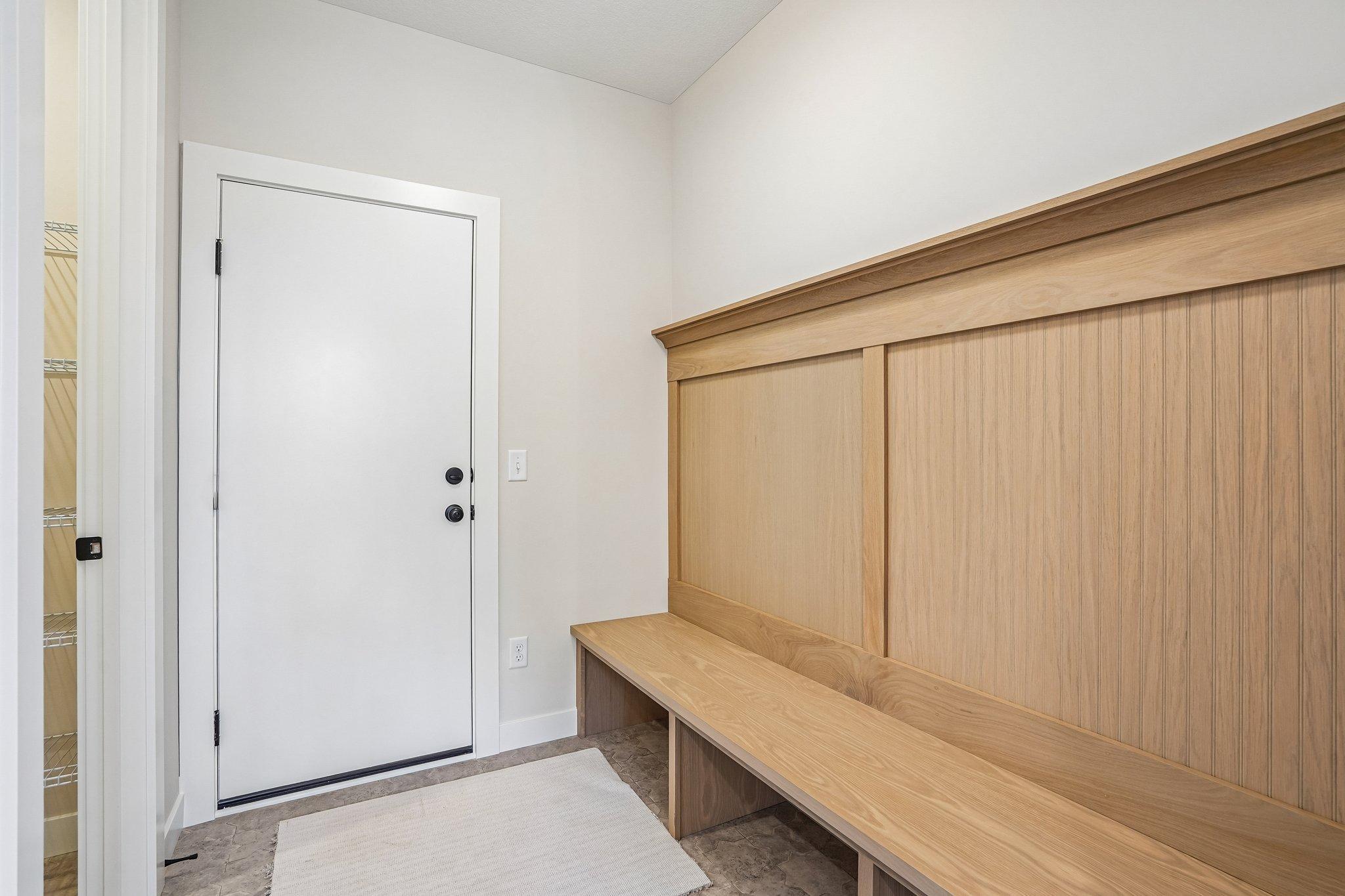 Built in mudroom bench, where everything has a place, is out of sight and out of mind!