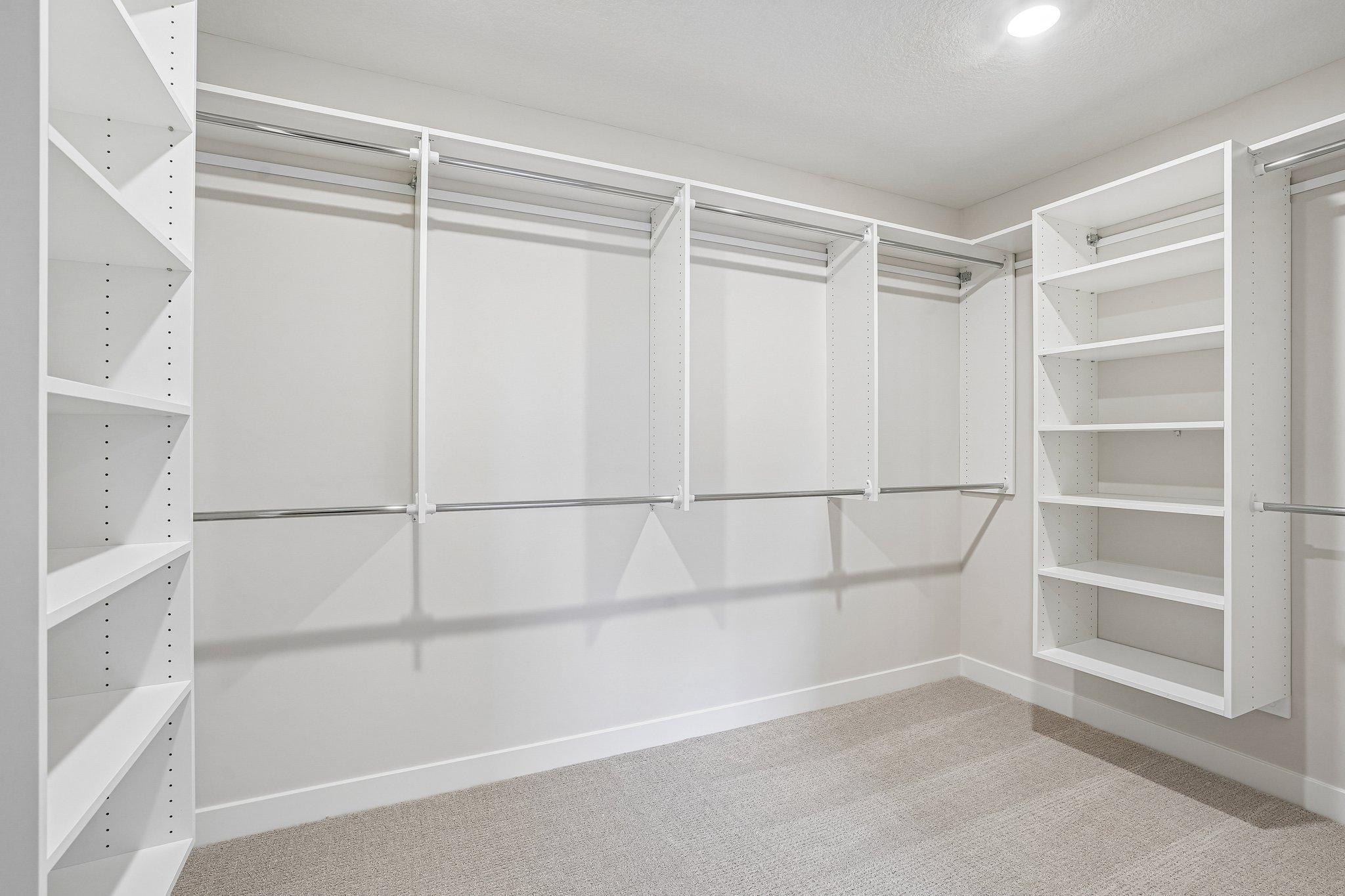 Huge Walk in Closet in the Primary complete with Custom Closet Shelving System.