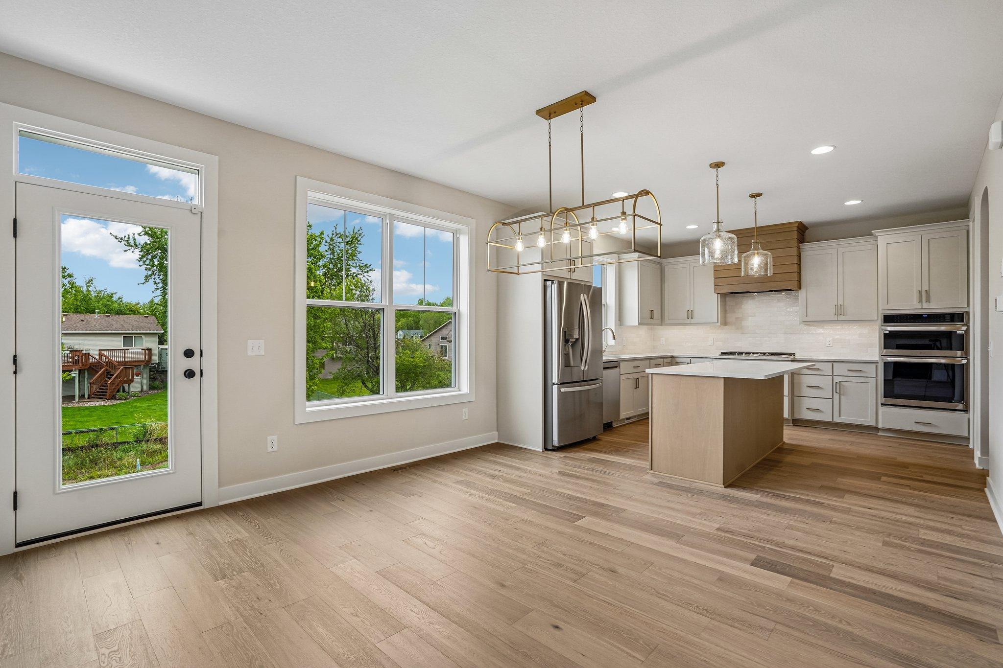Dinette space with oversized windows let in ample natural light.