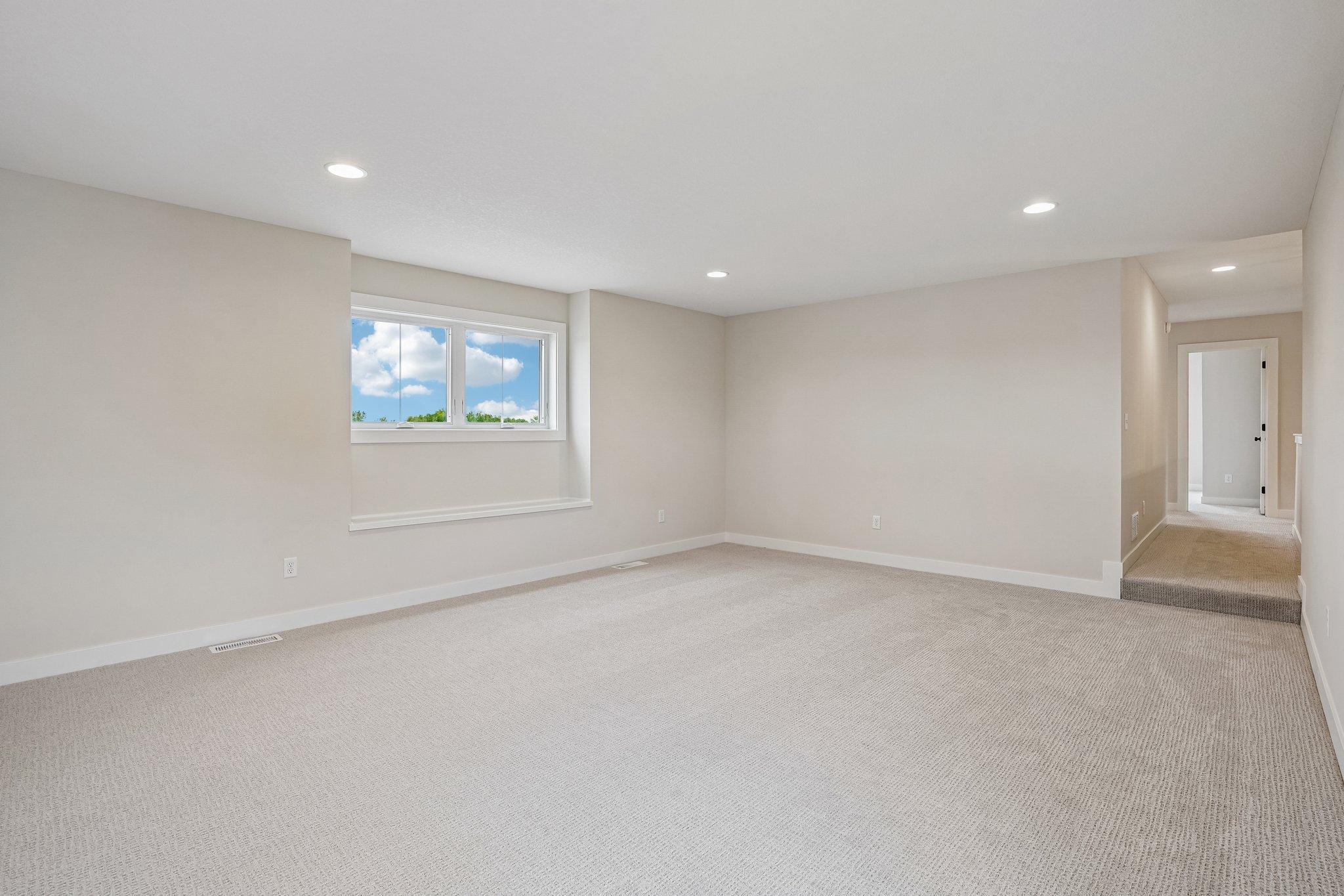 Bonus room is completely tucked to the side of the upper level creating the perfect separation of space.