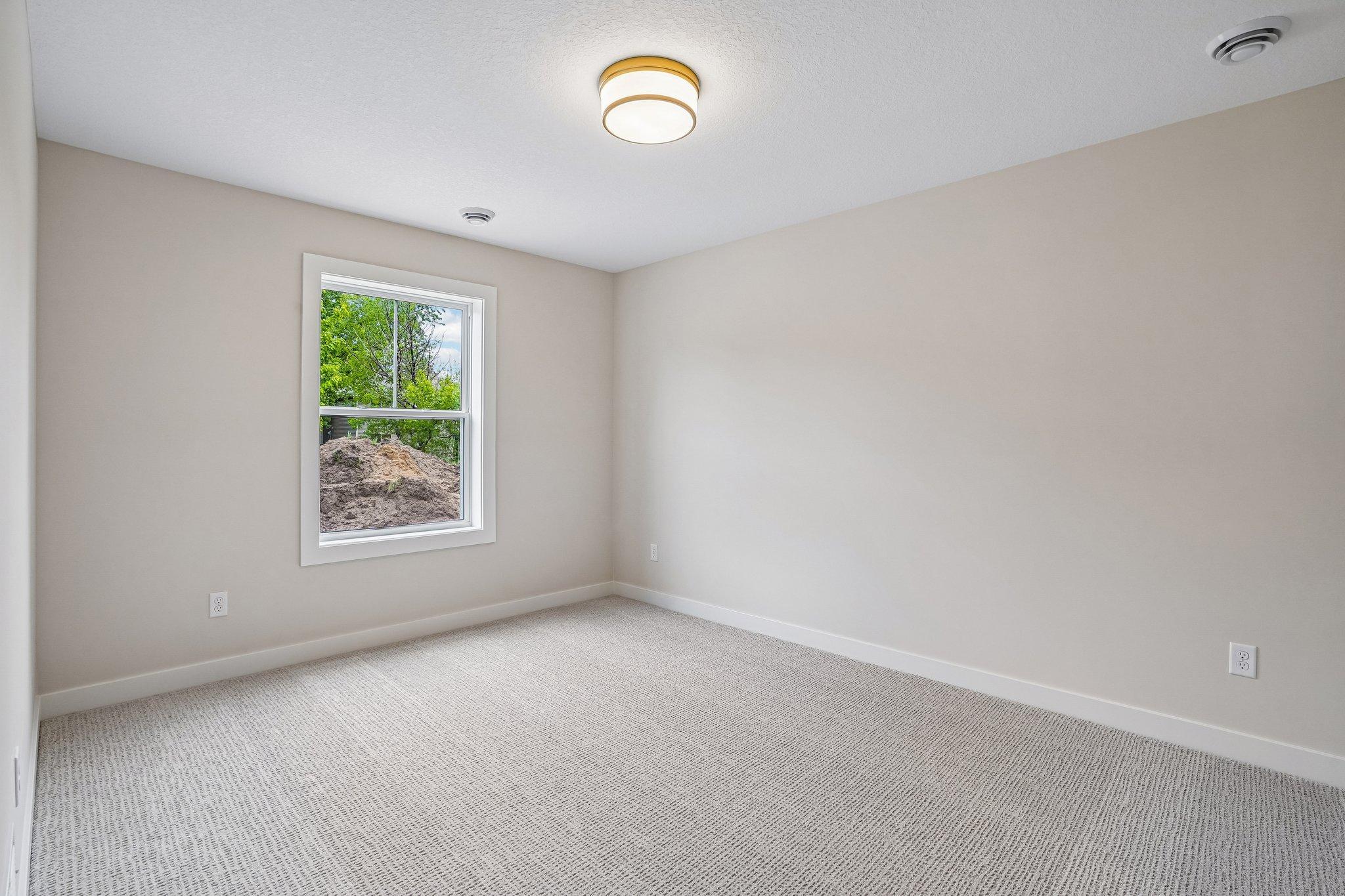 Generous sized 5th bedroom on the lower level - guest space, home gym? Anything is possible!