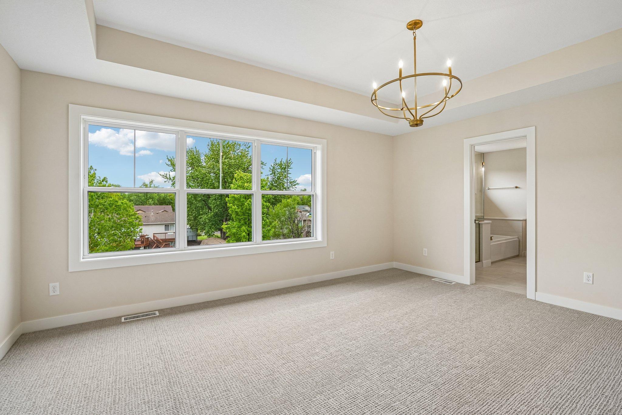 Primary Bedroom on Upper Level, complete with gorgeous gallery windows!