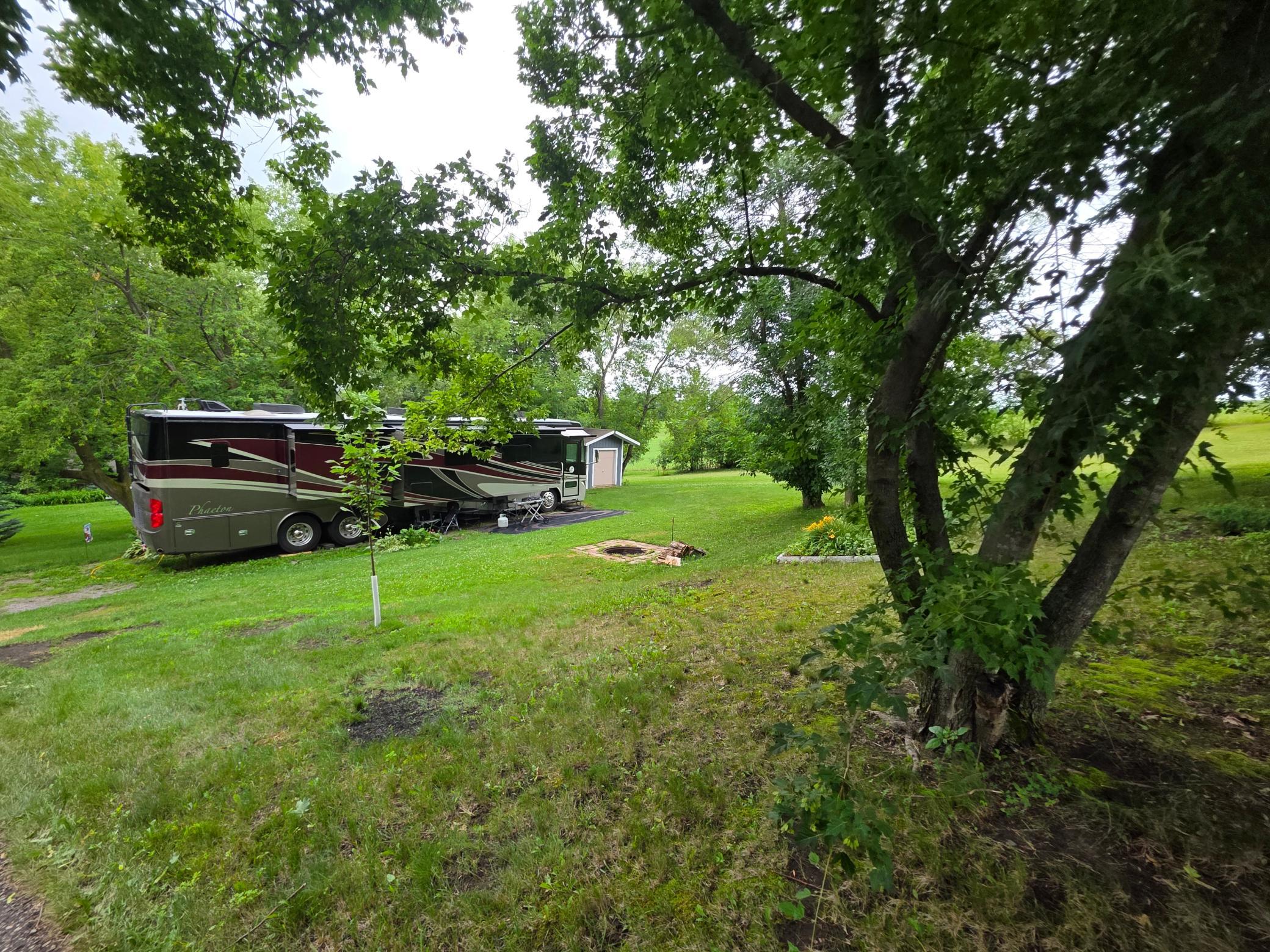 Space and more space on this huge unit with a shed and pad and firepit. Bring your own RV and stay awhile, better yet - buy this and own it!