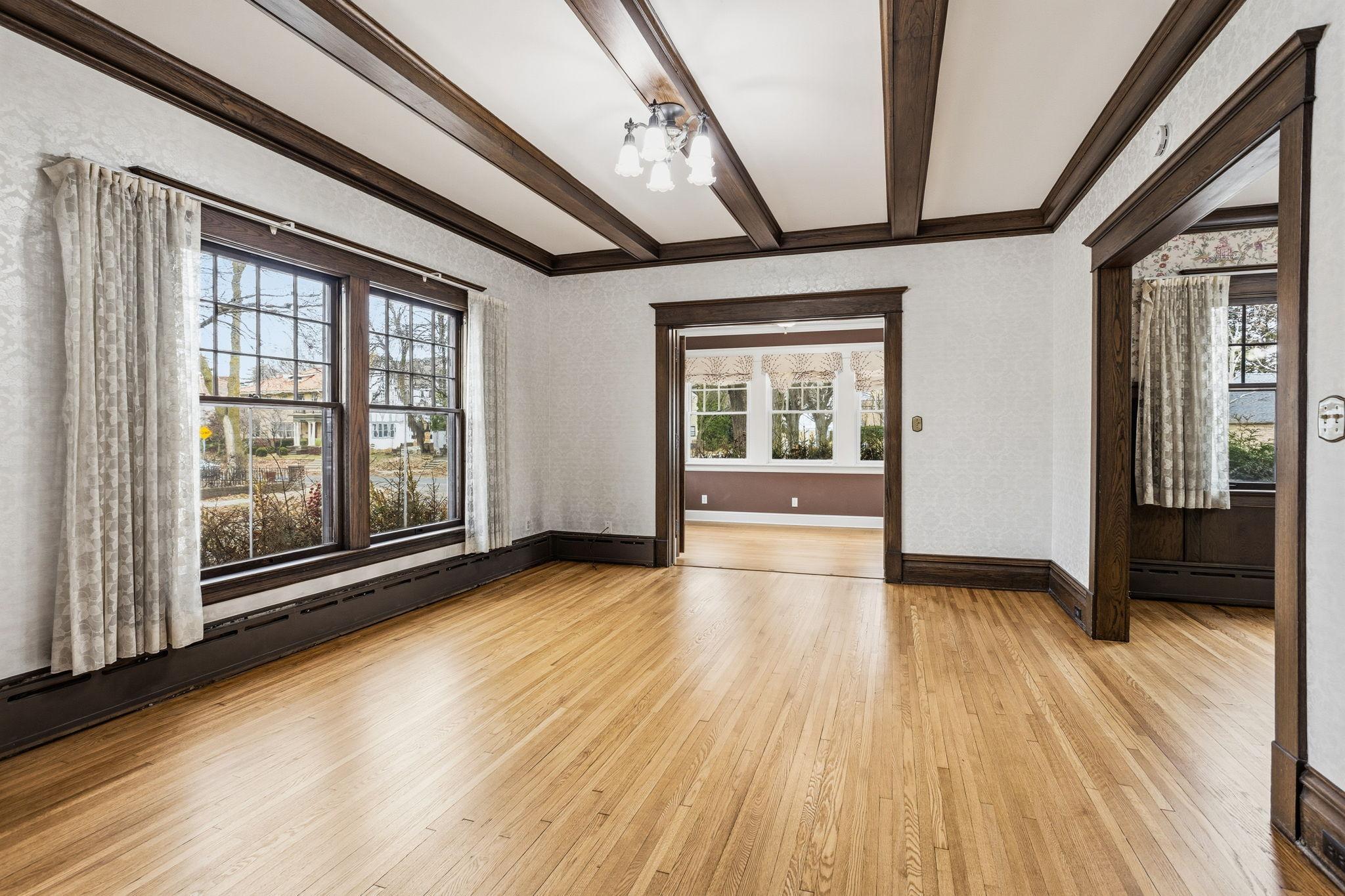 Light, bright living room with original ceiling beams.