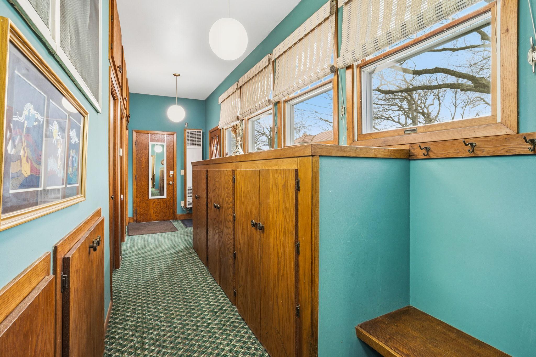 Heated breezeway with loads of storage attaches house to garage.