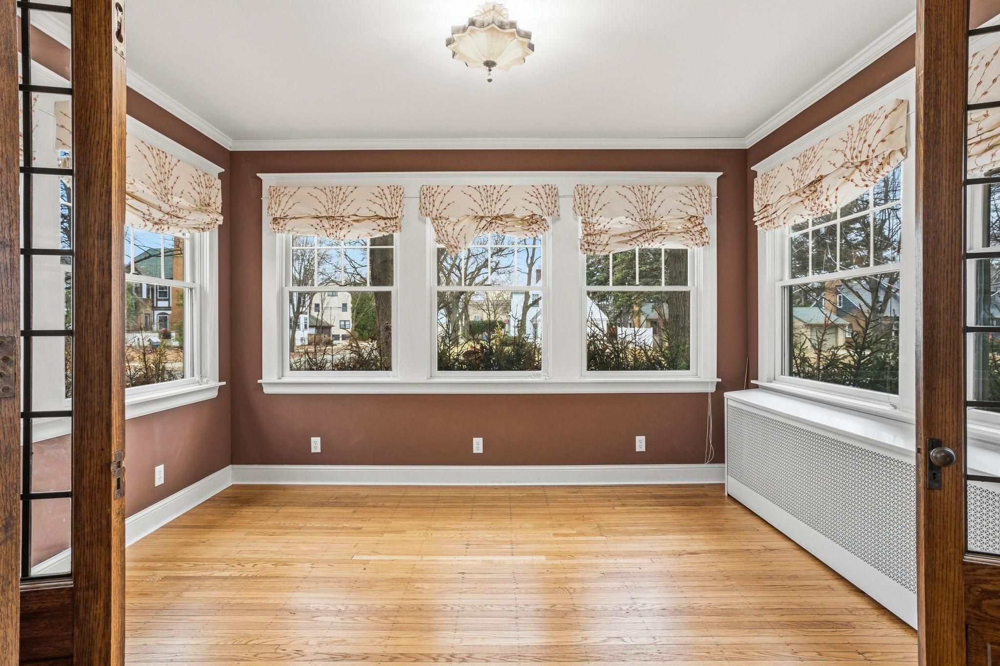 Sunroom with windows on 3 sides.