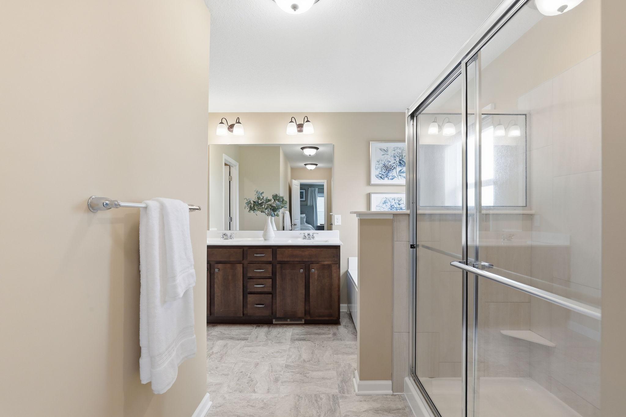 Primary ensuite bath is a private retreat with well-appointed finishes and a functional layout.