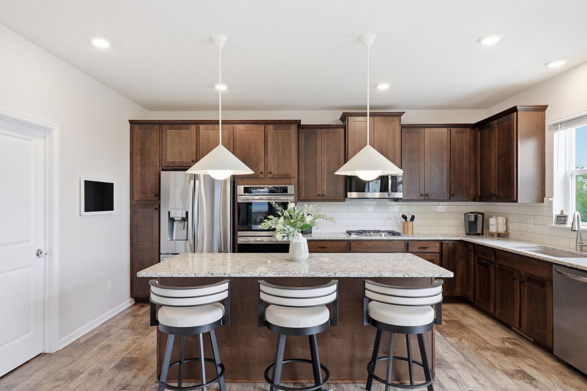 Gourmet kitchen designed for cooking and entertaining, featuring high-end finishes, quality appliances, and a functional, open layout.