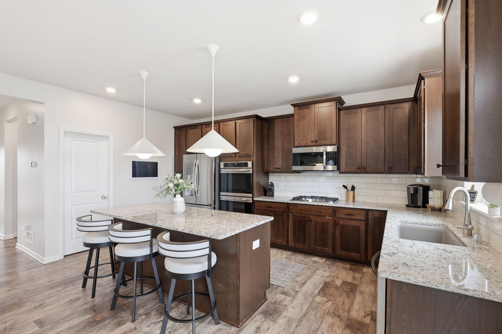 Amazing kitchen cabinetry showcasing exceptional craftsmanship, ample storage, and a beautiful, high-end finish.