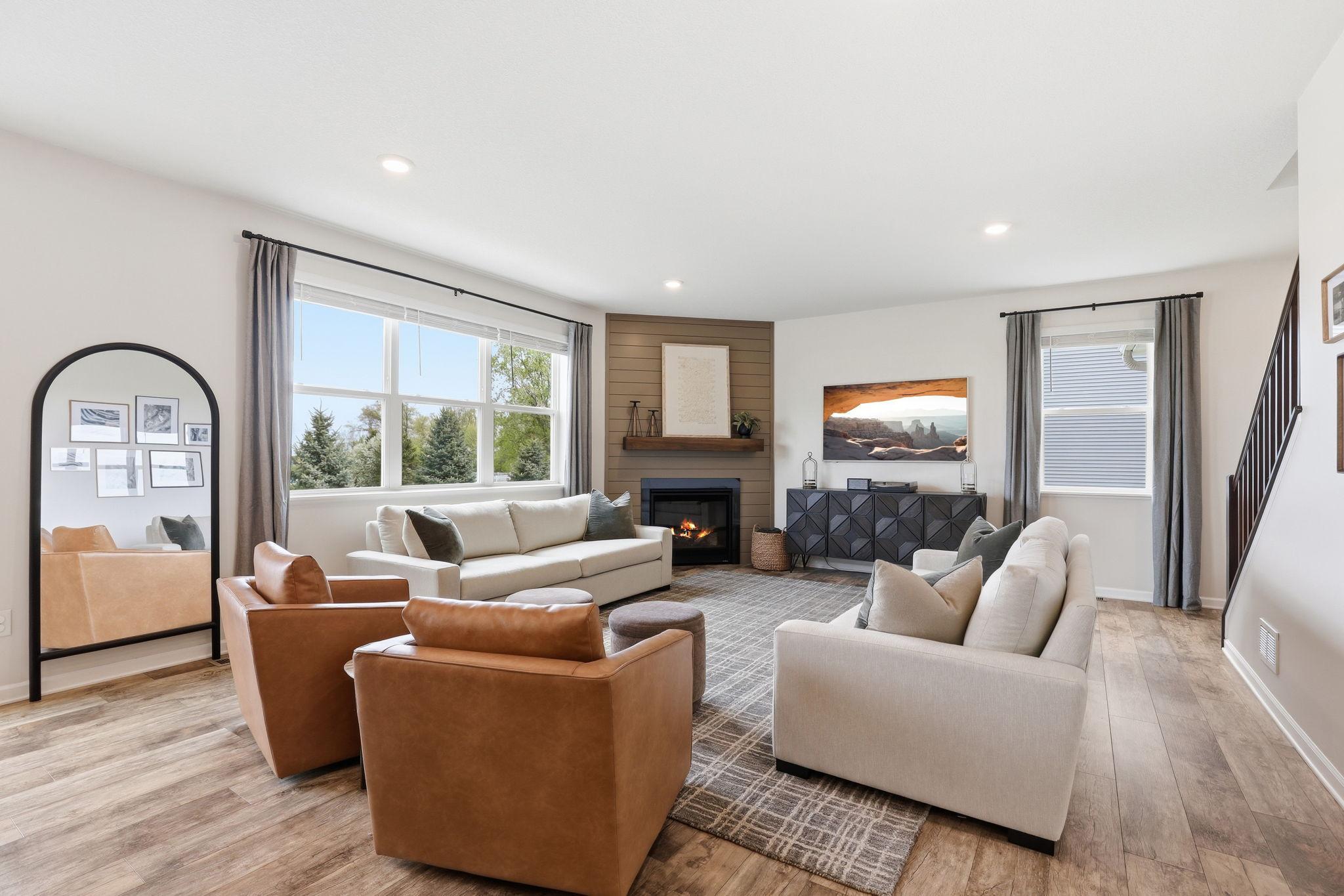Living room featuring a cozy gas fireplace, creating a warm and inviting focal point