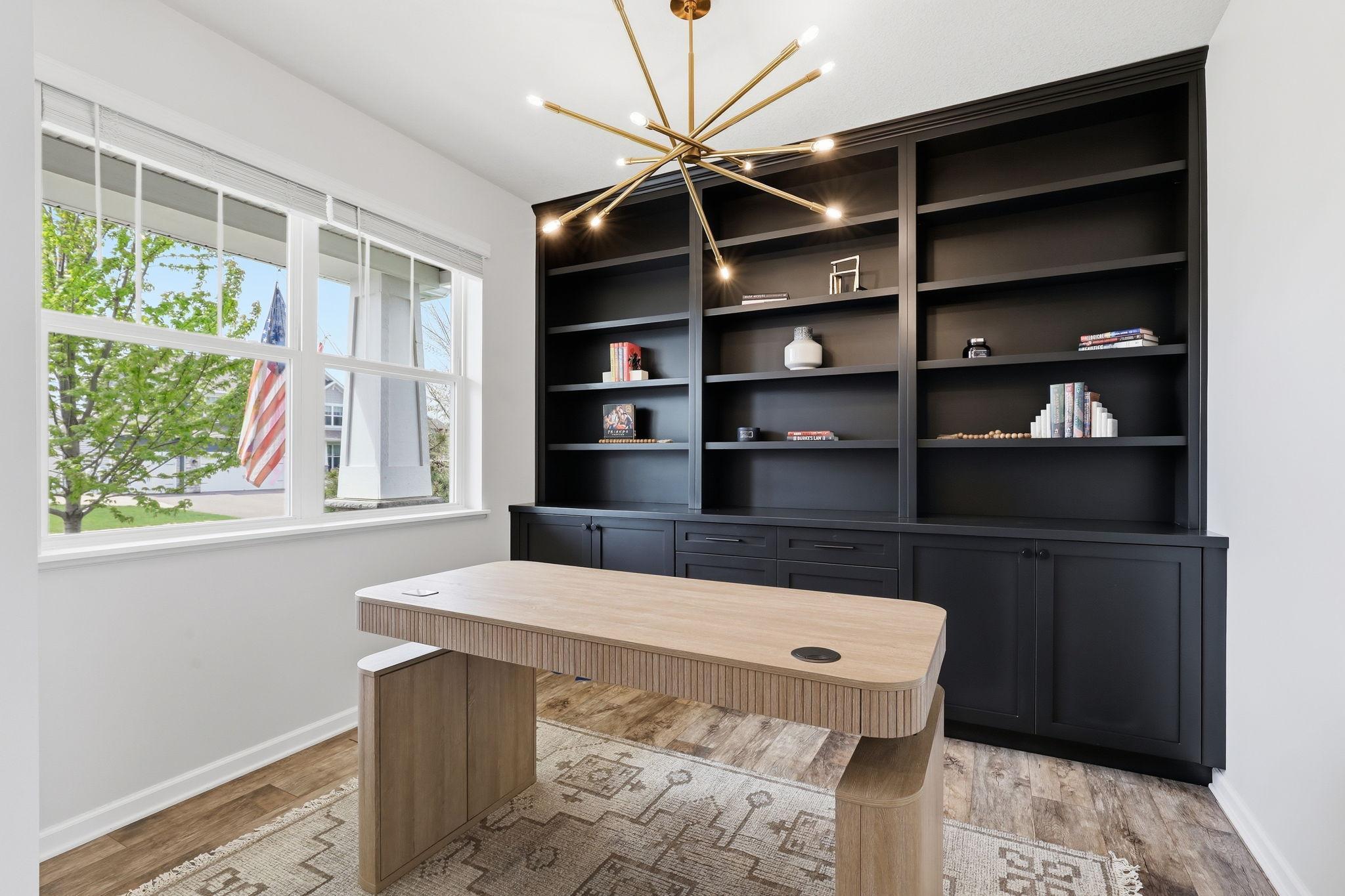 Massive windows fill the workspace with abundant natural light.