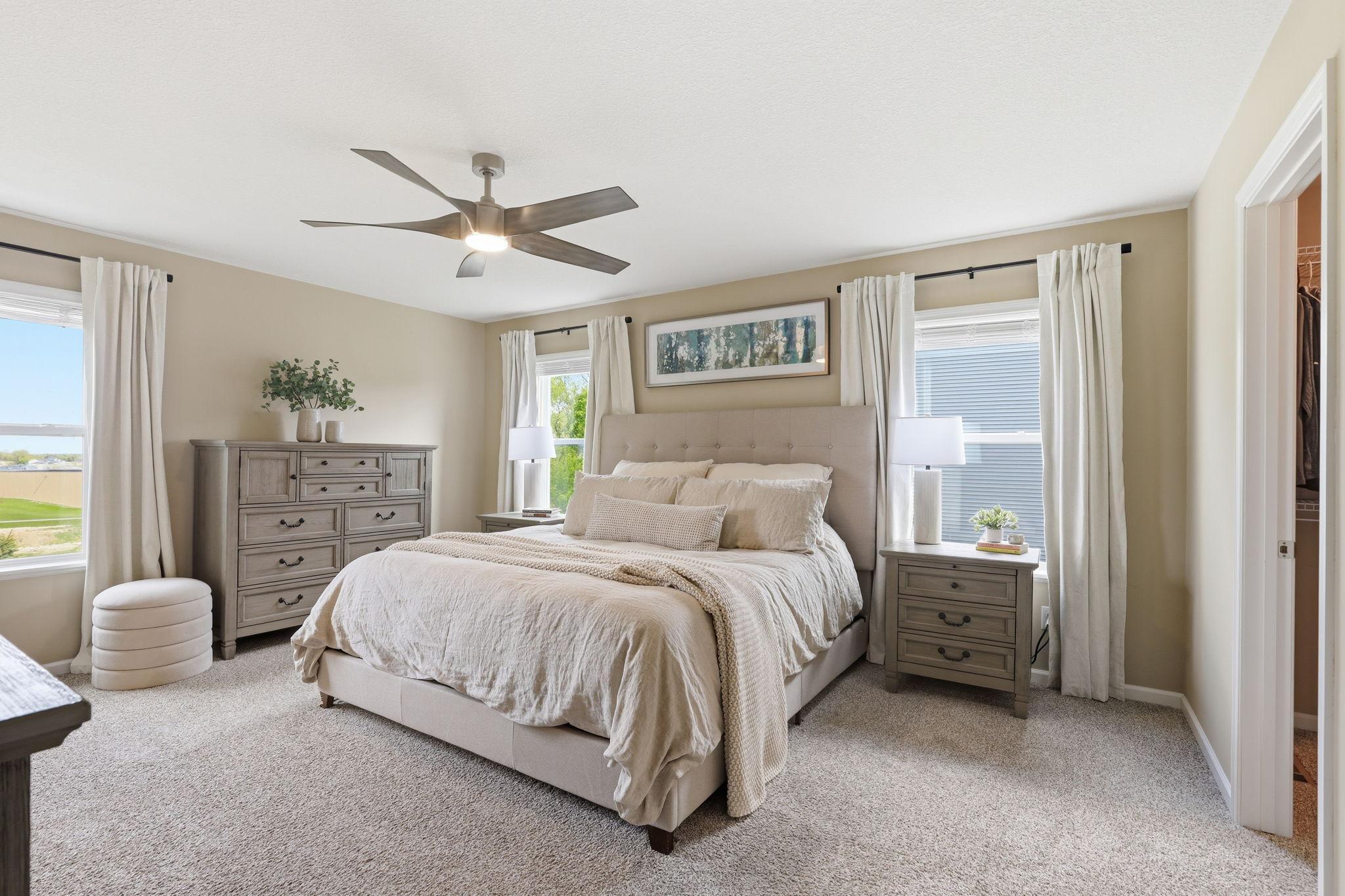 Primary suite offering a spacious retreat with a comfortable layout, ample natural light, and a relaxing atmosphere.