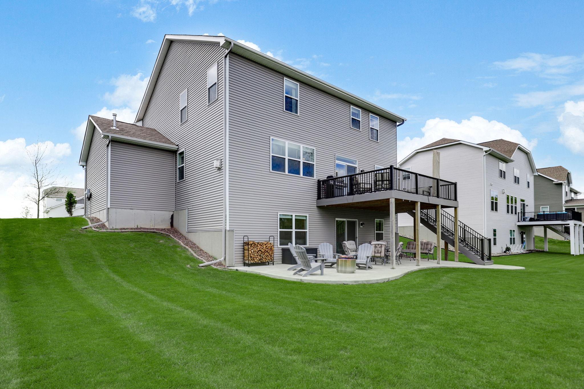 Backyard designed for entertaining, offering a spacious setting ideal for gatherings, outdoor dining, and relaxing with guests.