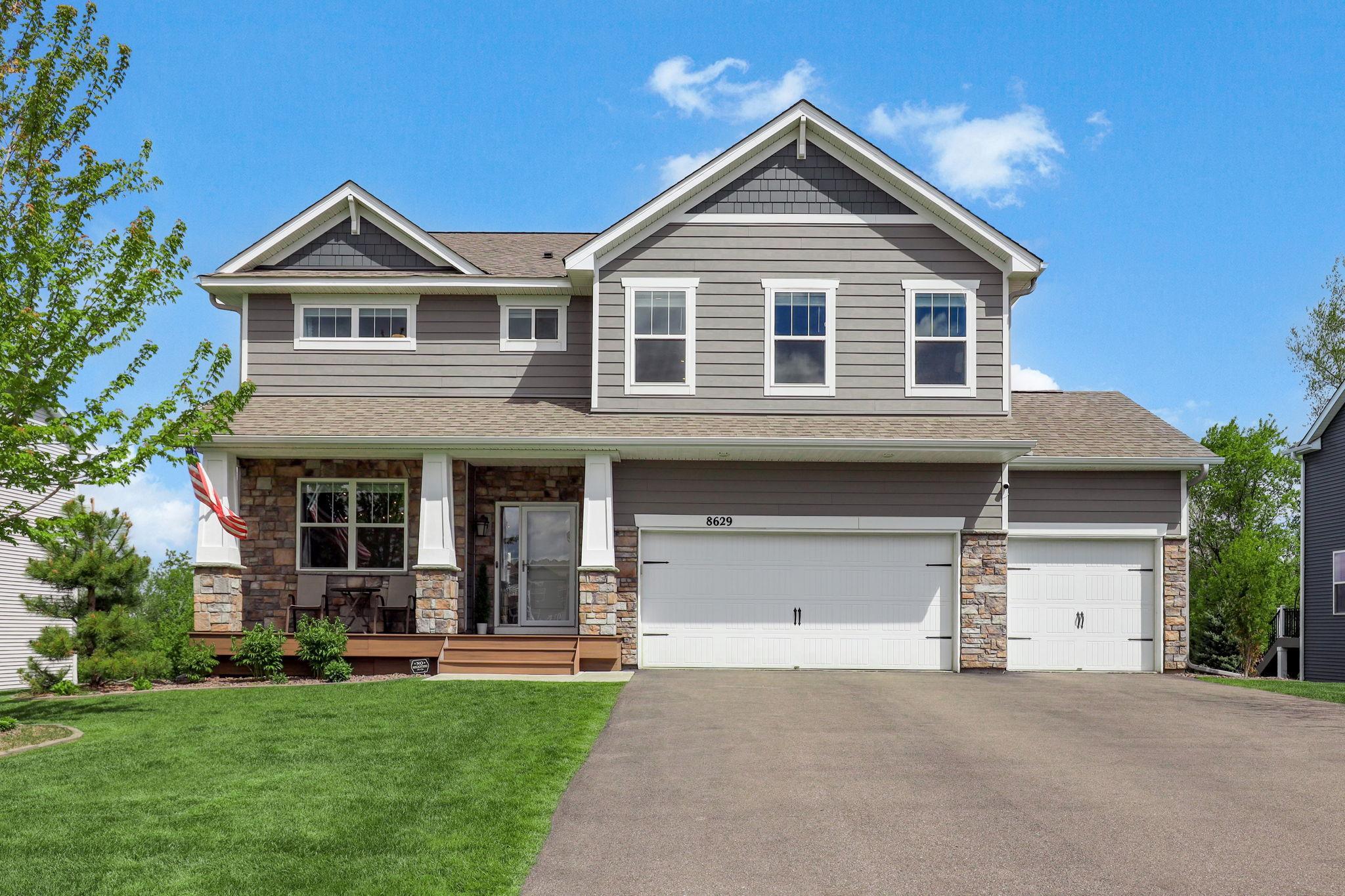 Spacious three-car garage with NEW heater (2024) ample room for vehicles, storage, and workspace.