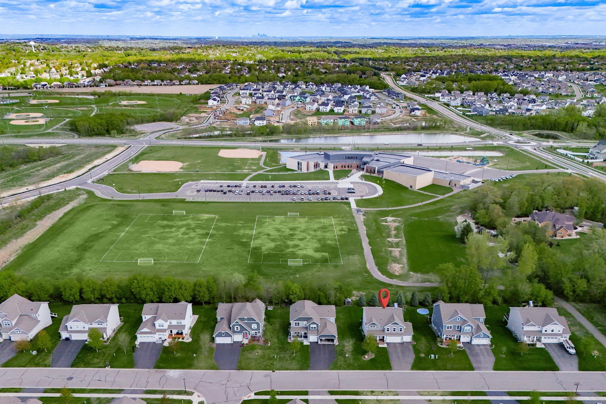 Check out the amazing green space behind this property. Great place to walk, run or kick a soccer ball around!
