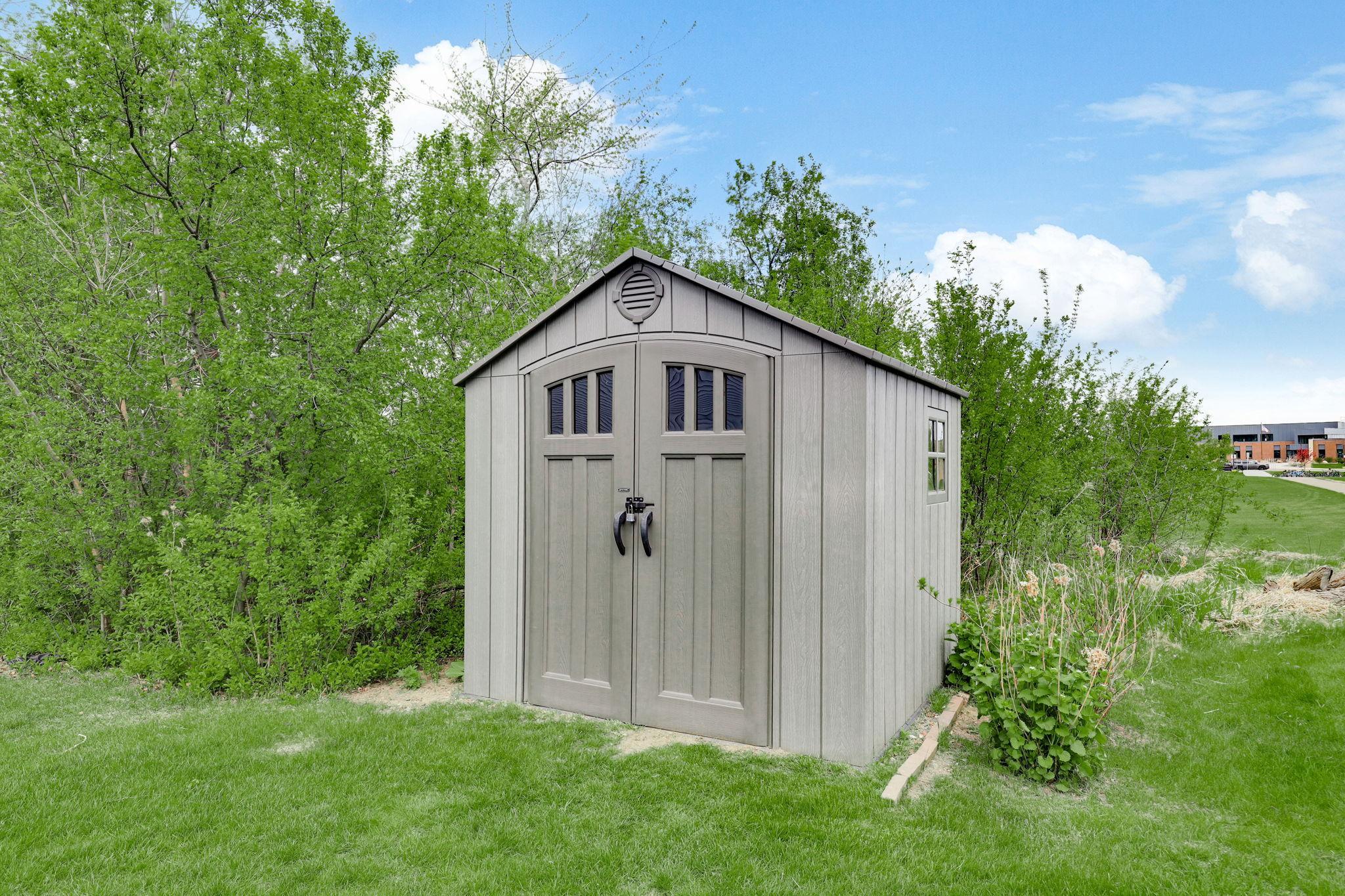 NEW outdoor shed (2023) providing convenient storage space for tools, equipment, and seasonal items.