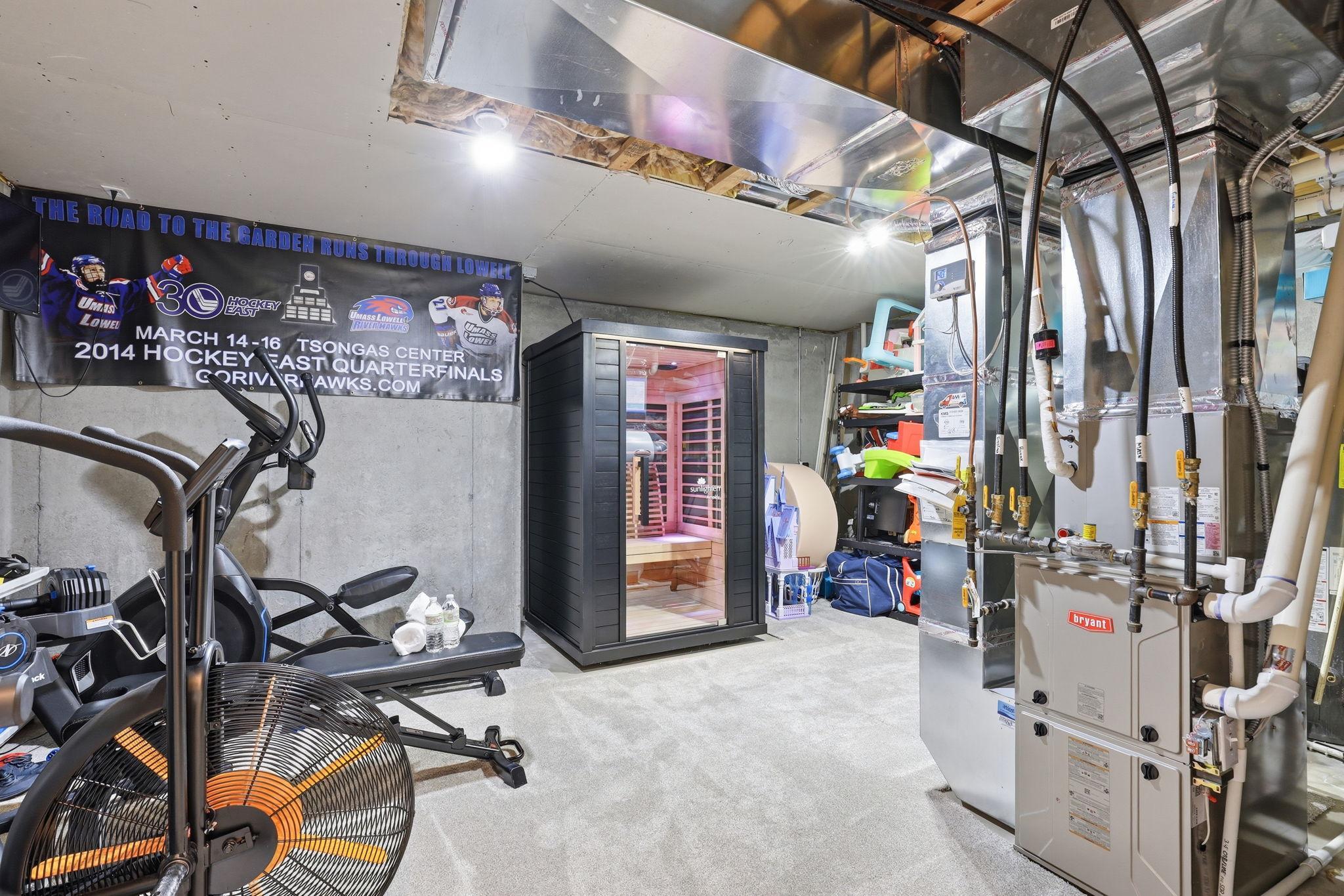 Spacious mechanical room offering abundant additional space, ideal for a home gym, storage, or flexible use to suit your needs.