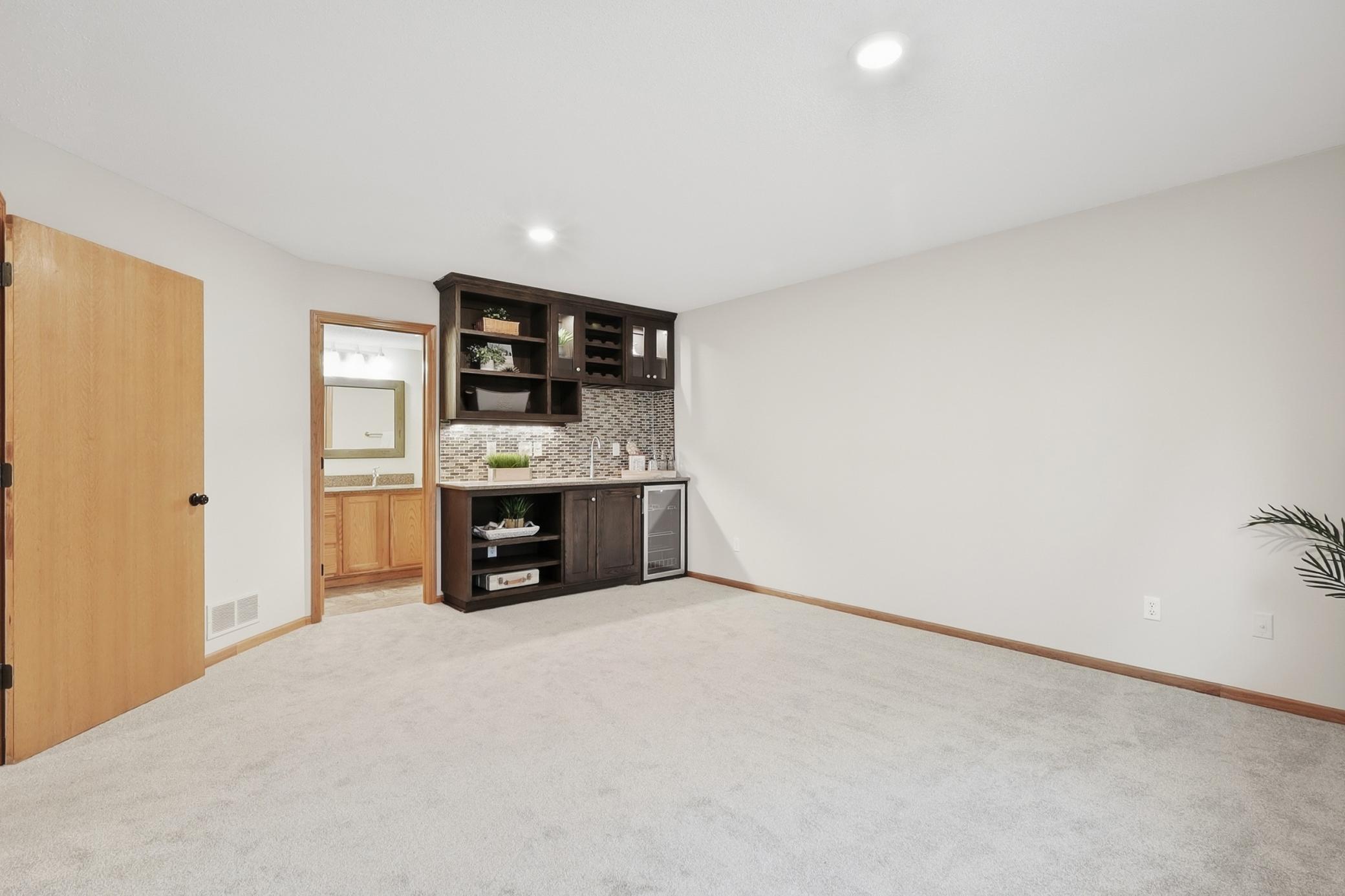 Lower level wet bar in 3rd bedroom or Family Room.
