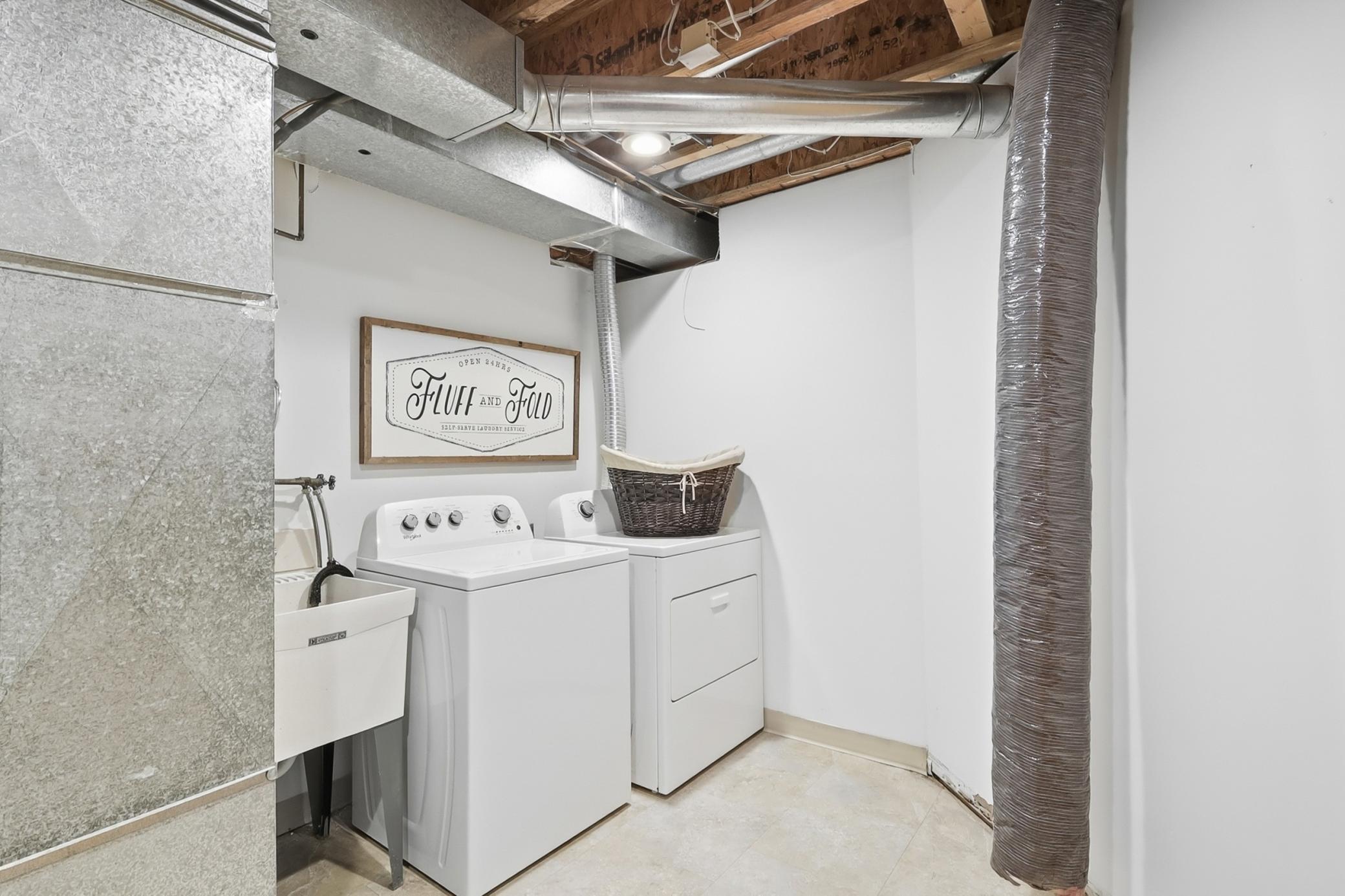 Laundry and mechanical room with room for storage- plus under the stair storage too!