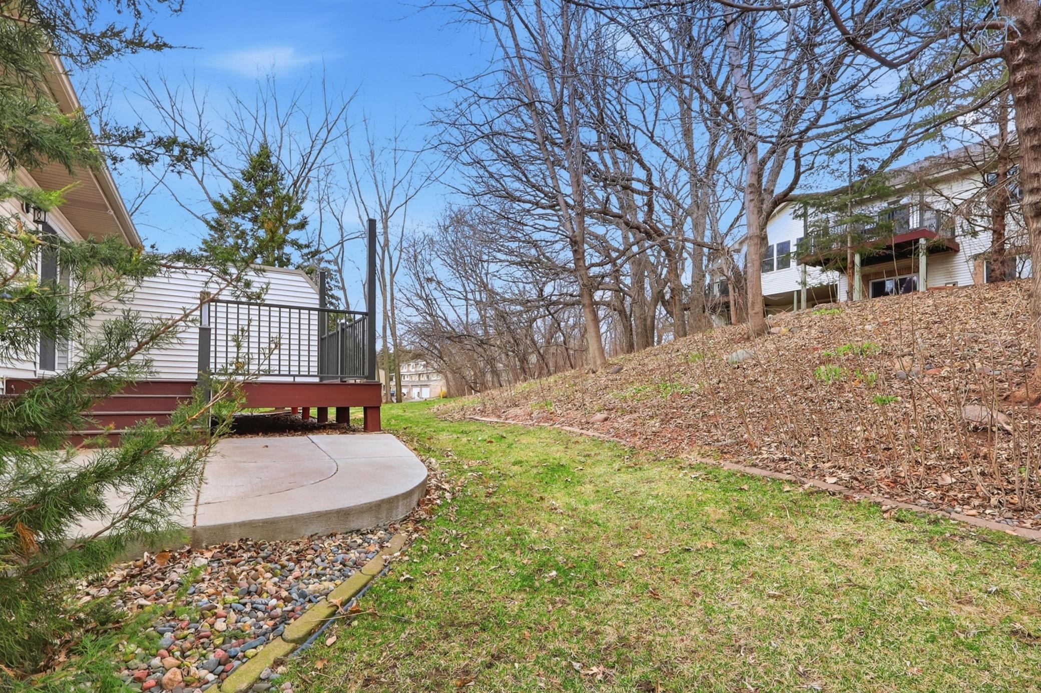 Hard to find a setting like this with a deck, patio and the views of trees.