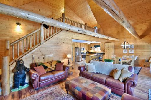 Main Floor Living Area with Staircase to Loft and Primary Suite.