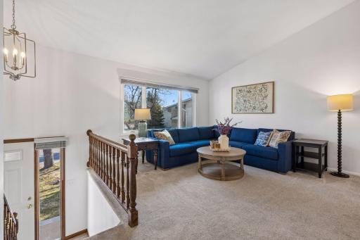 Spacious living room is light and bright with lovely finishes