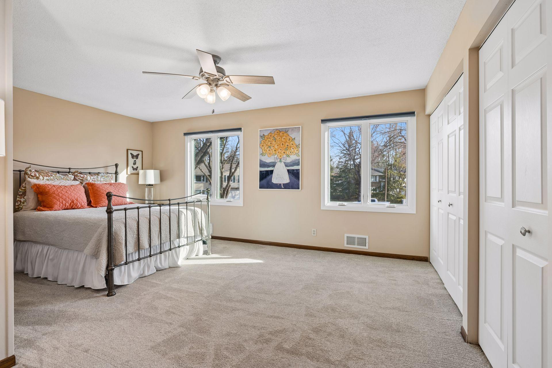 Large primary bedroom with ceiling fan