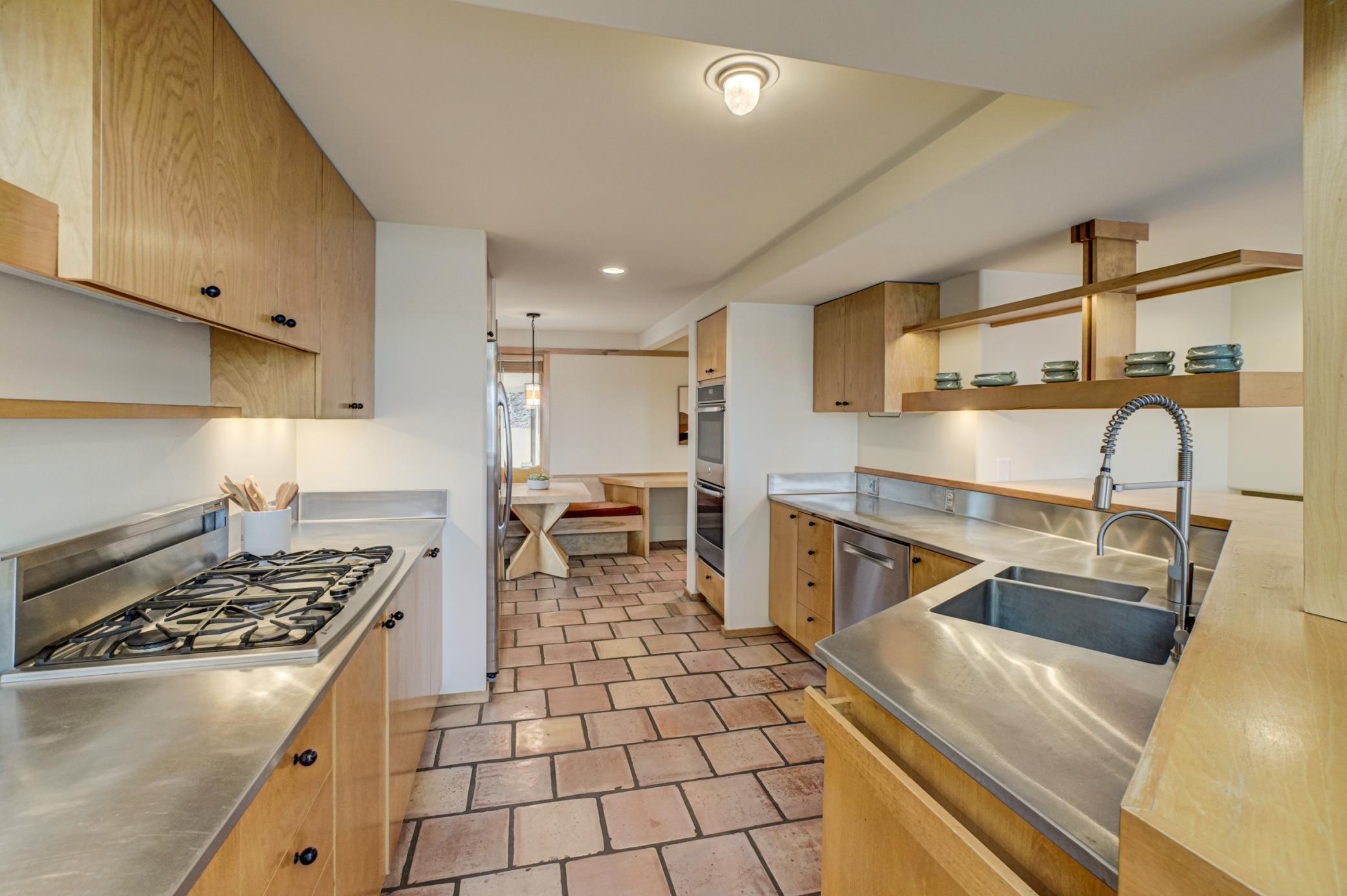 Kitchen has gas stove top and double ovens