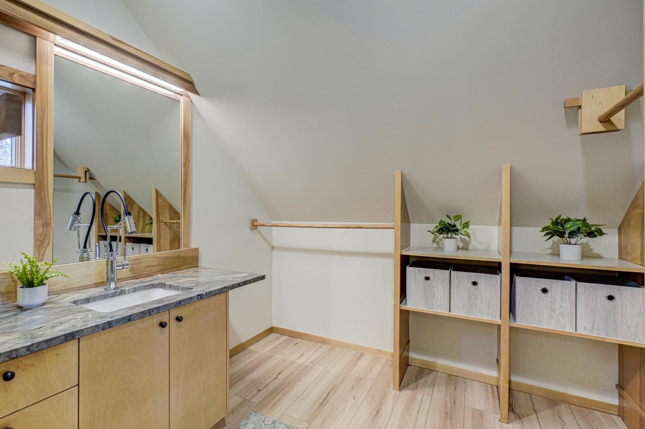 Upper level nook for storage and laundry