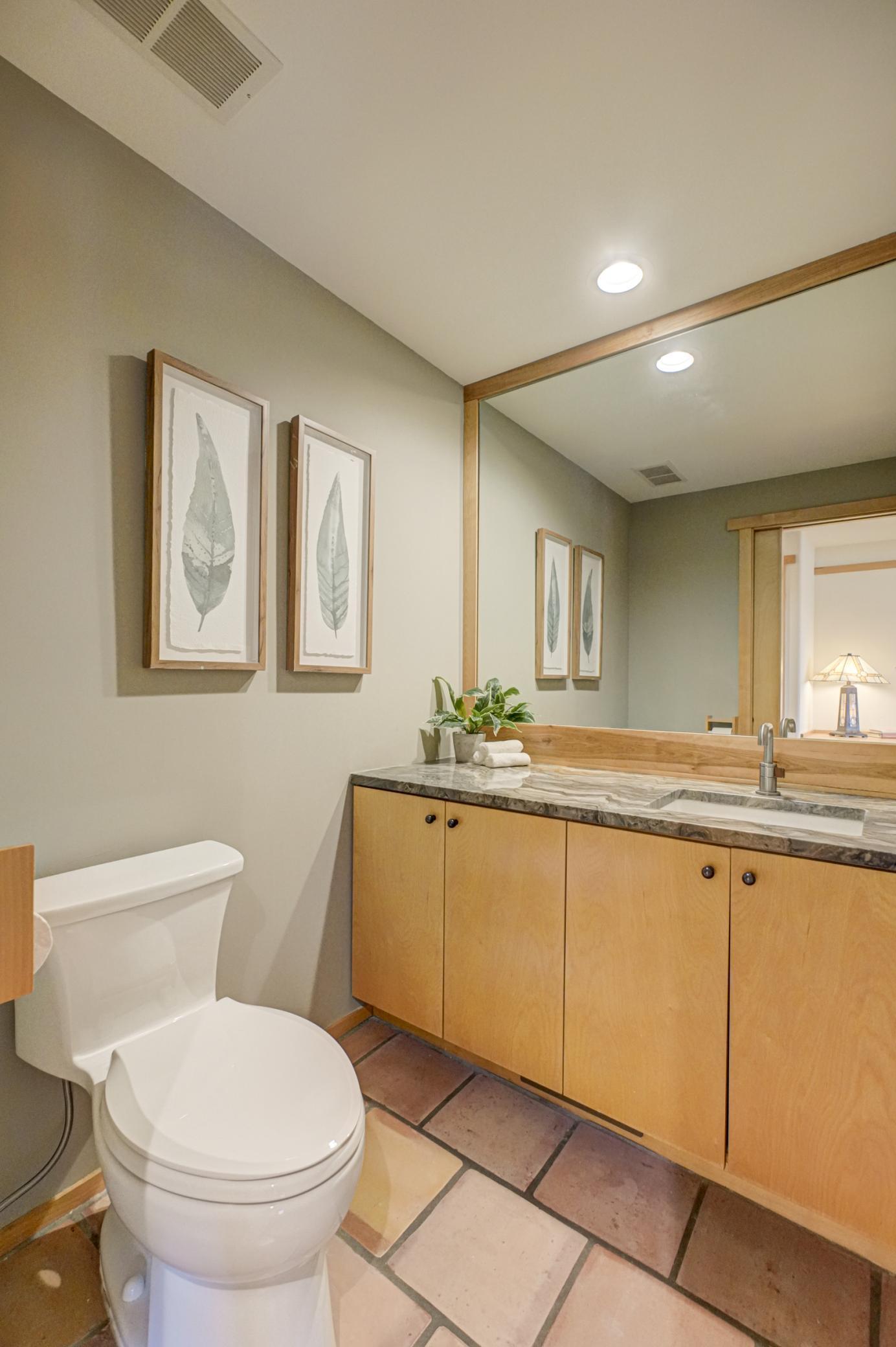 Main floor half bath is tucked away