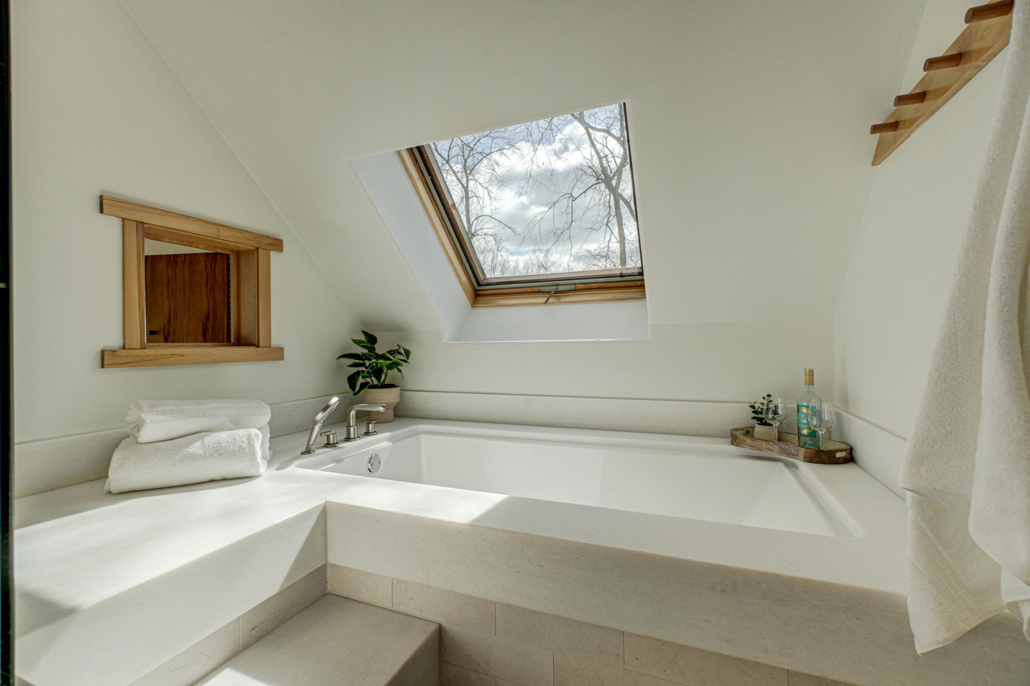 Enjoy peek-a-boo views from the primary bathroom