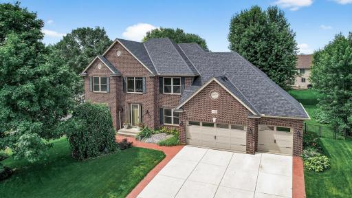 Welcome Home! Striking curb appeal highlighted by a timeless all-brick faÃ§ade with elegant architectural detailing