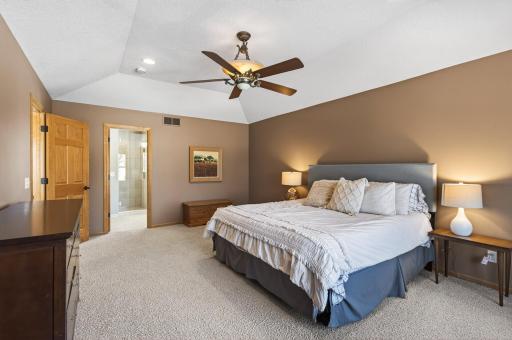 Spacious ownerâs retreat featuring vaulted ceilings and a beautifully remodeled en-suite bath