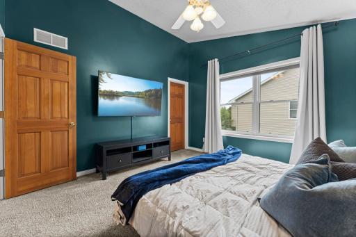 The primary suite features a walk-in closet and walk-through access to the full bathroom.