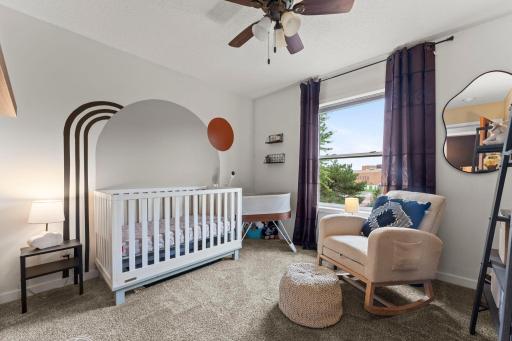 Two additional bedrooms are located on the upper level.