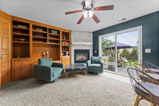 Walk straight outside to the back patio and level, fully fenced yard for an easy indoor-outdoor connection.
(Bar not included in sale of home)
