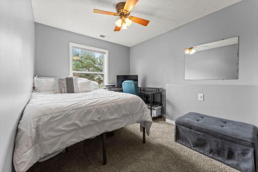 An additional bedroom on this level offers flexibility for guests, a home office, or whatever suits your needs.