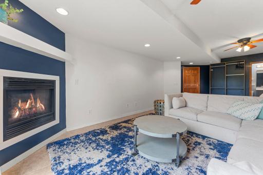 The lowest level keeps the options coming with a spacious recreation room featuring tile flooring and a second gas fireplace.