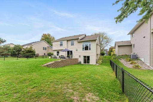 The outdoor setup is ideal, with fresh landscaping rock around the front and back of the home.