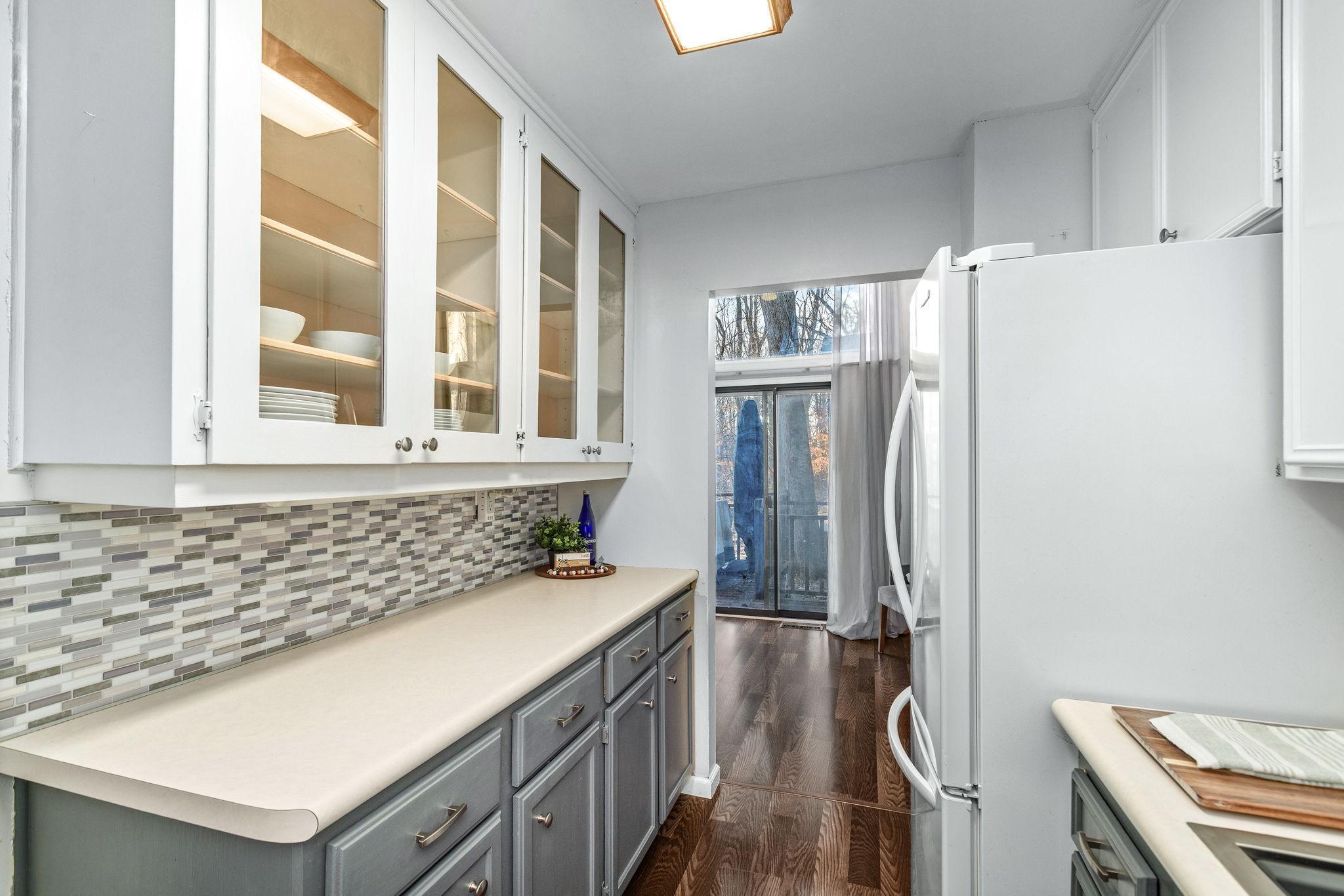 open to dining room and more light/views through one of two sliding doors!